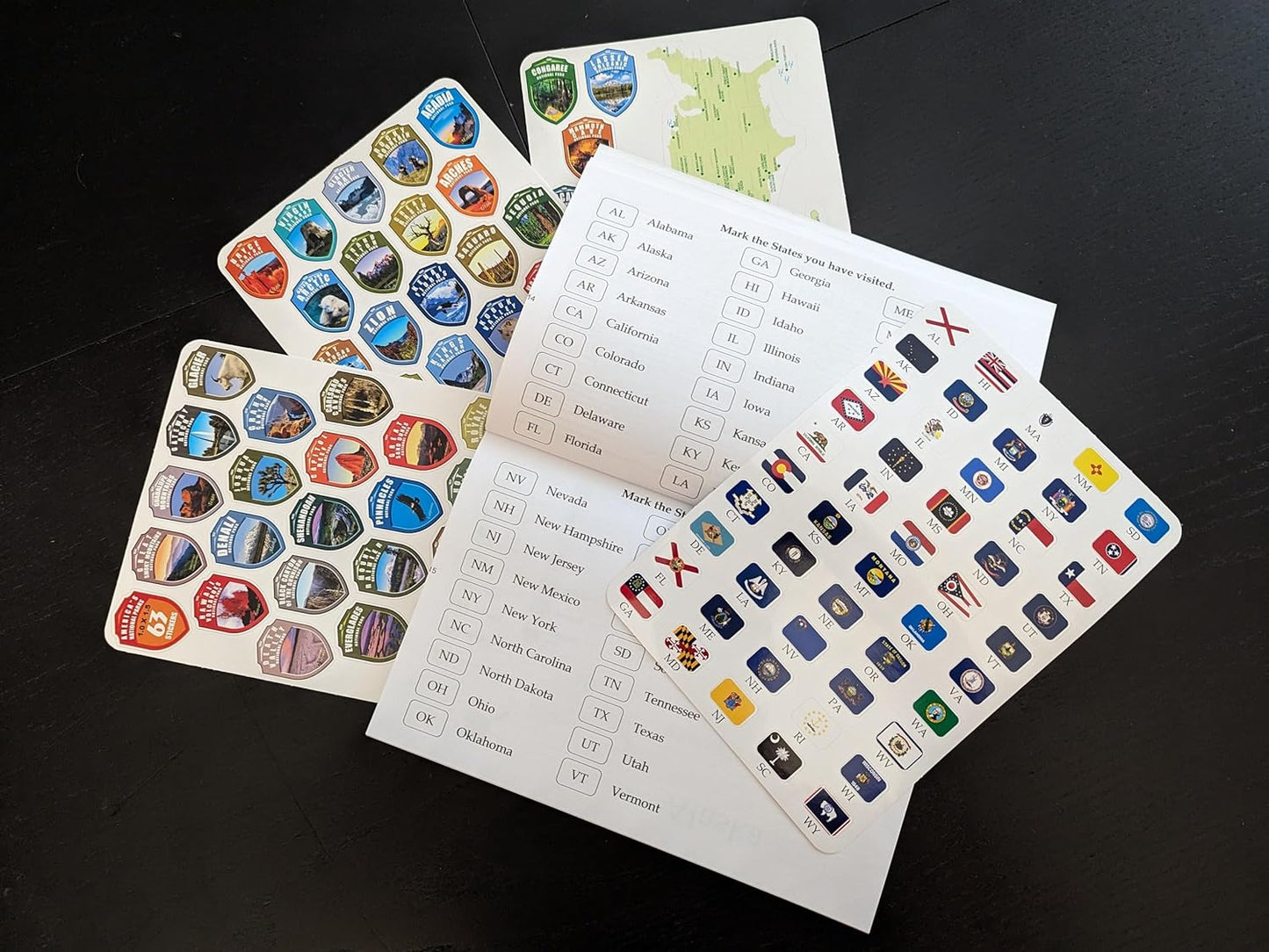 Adventures Go On. The book 2024 (170 pages) is a guide to the National Parks of the United States of America with complete stickers for all 63 US National Parks.